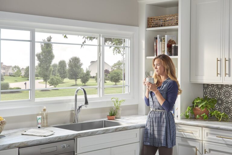 woman looking out window